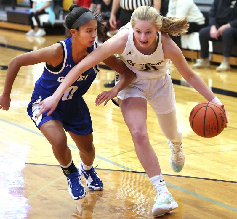 Sycamore’s Lexi Carlsen tries to drive past Geneva's Riley Hasegawa during their game Monday, Nov. 14, 2022, at Sycamore High School.
