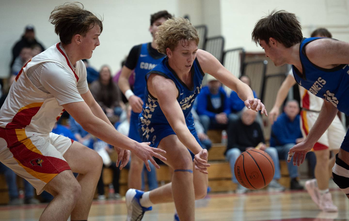 Clifton Central's Jake Thompson, center, looks to recover a loose ball over St. Anne's Jason Bleyle, left, in the RVC Tournament Championship on Friday, Feb. 13, 2026.