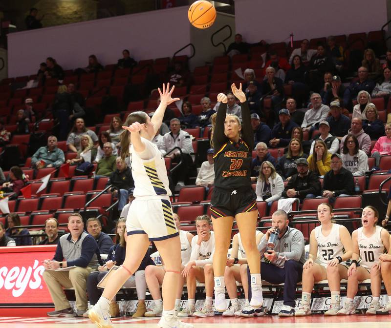 Montini's Lily Spanos lets go of a shot over Quincy Notre Dame's Jenna Durst during the Class 3A State semifinal game on Thursday, March 6, 2025 at CEFCU Arena in Normal.