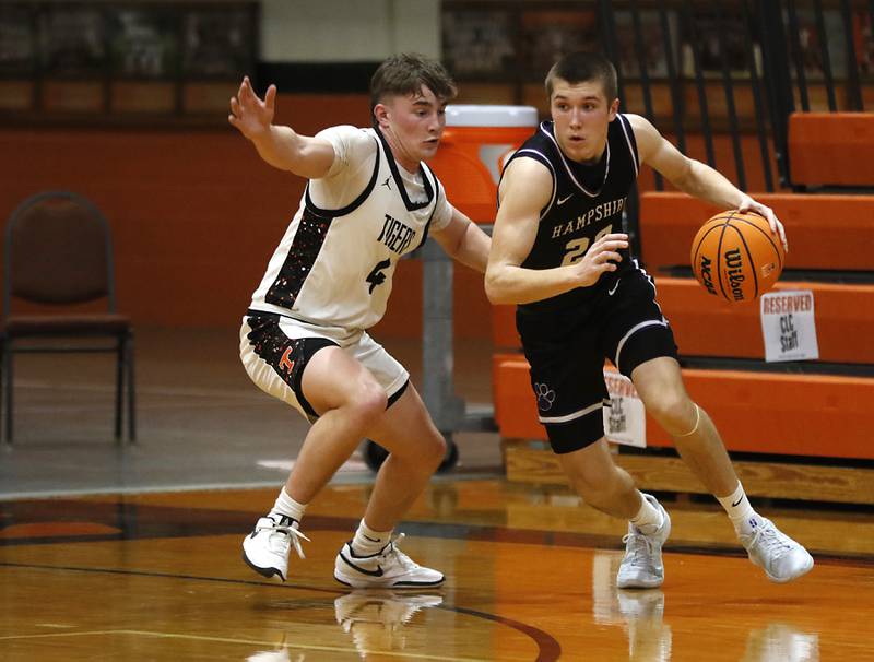 Hampshire's Ryan Prowicz drives to the basket against Crystal Lake Central's Carter Kelley, during a a Fox Valley Conference basketball game on Friday, Feb. 7, 2025, at Crystal Lake Central High School.