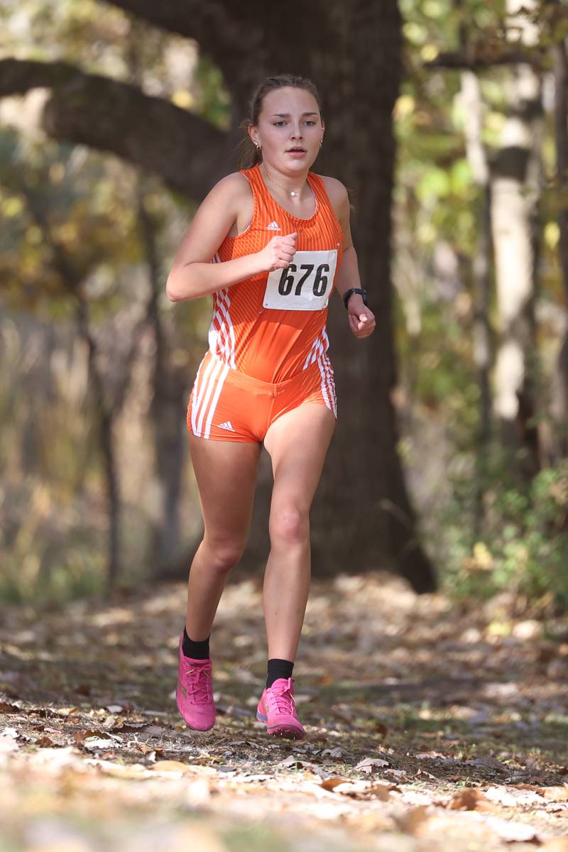 Oswego’s Audrey Sorderlind leads the group midway in the Girls Cross Country Class 3A Minooka Regional at Channahon Community Park on Saturday.