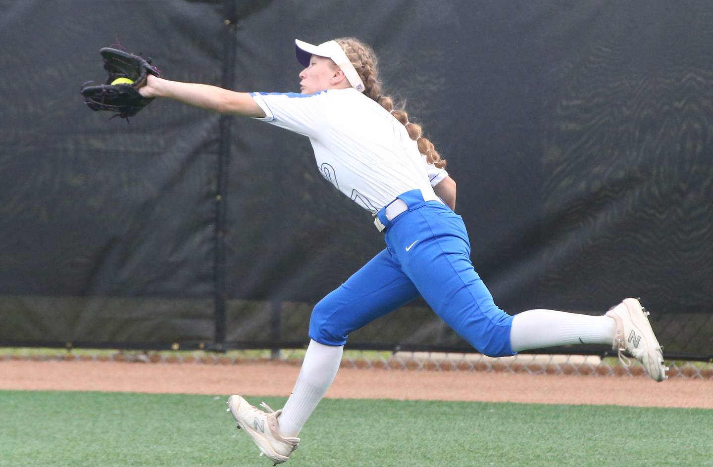 St. Charles North's Ashlee Chantos makes a running catch in the Class 4A softball state championship on Saturday, June 11, 2022 at the Louisville Slugger Complex in Peoria.