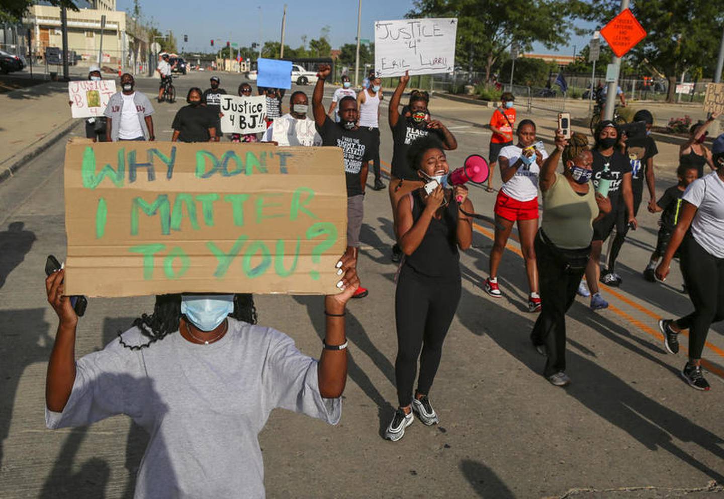 Demonstrators can be seen protesting outside Joliet City Hall, the Will County Courthouse and the Joliet Police Department on Saturday, Aug. 22, 2020, in response to the January 28 overdose death of Eric Lurry who died in police custody.