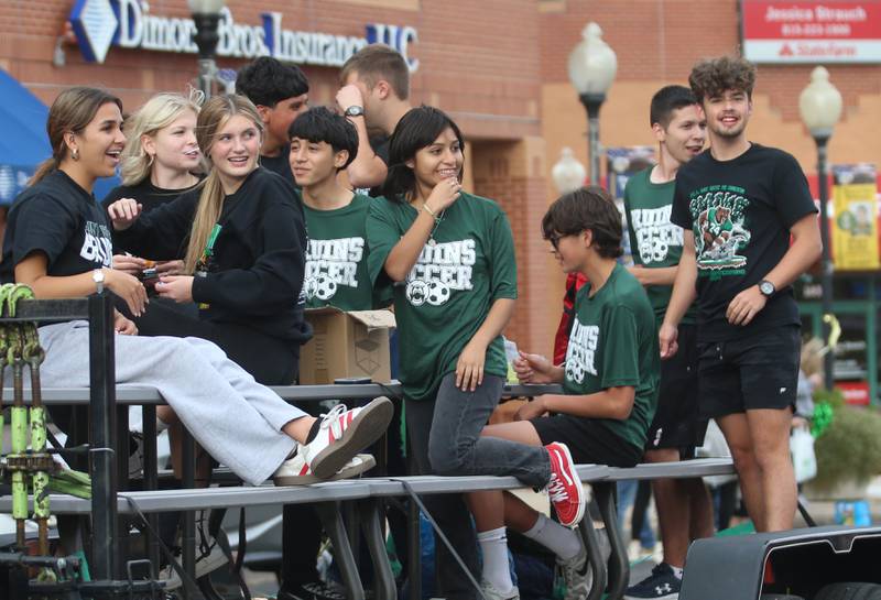 St. Bede soccer players ride on a float during the St. Bede Homecoming parade on Friday, Sept. 27, 2024 downtown Peru.