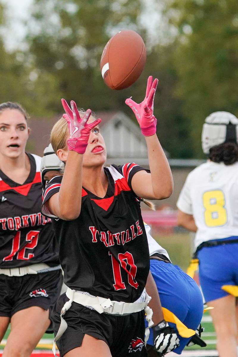 Yorkville's Hayden Hodges (12) intercepts a pass against Joliet Central during a flag football game at Yorkville High School on Monday, Sep 23, 2024.
