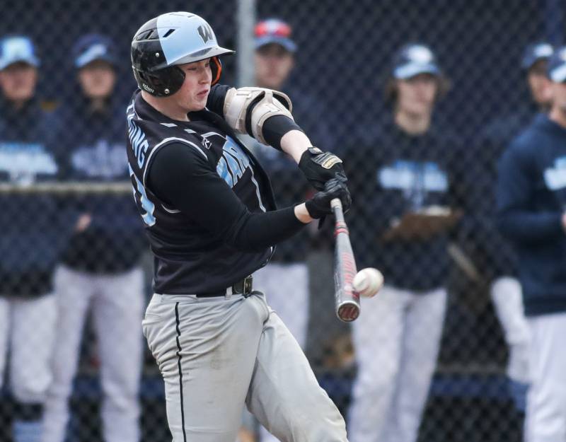 Willowbrook’s Bennett Fleming connects for a 2 RBI base hit against Downers Grove South during a game in Downers Grove on Tuesday, April 5, 2022.
