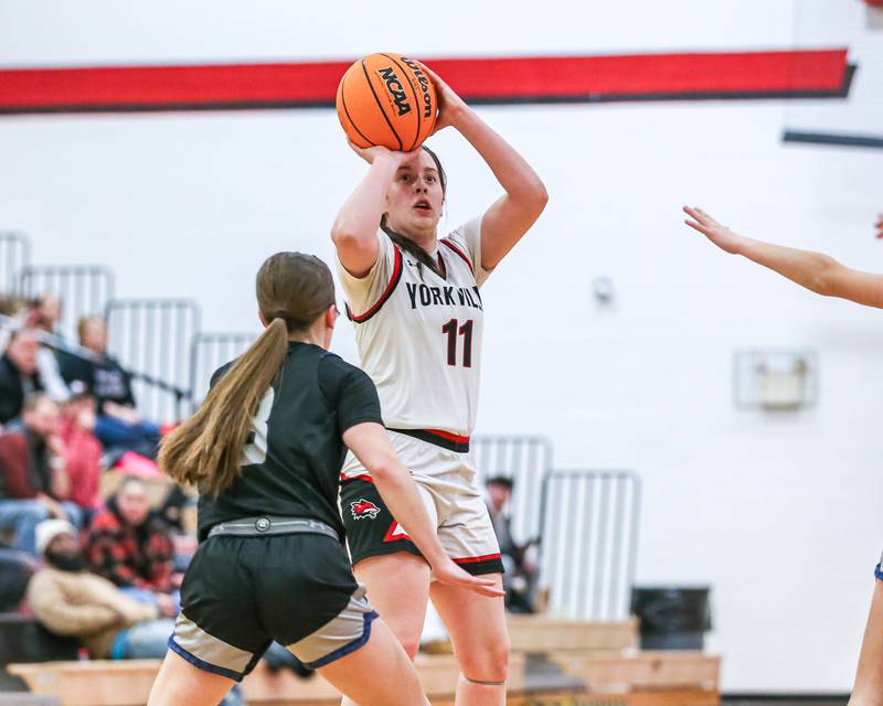 Yorkville's Brooke Spychalski (11) shoots a jump shot during their basketball game between Oswego East at Yorkville, Thursday  Dec 12, 2024 in Yorkville.