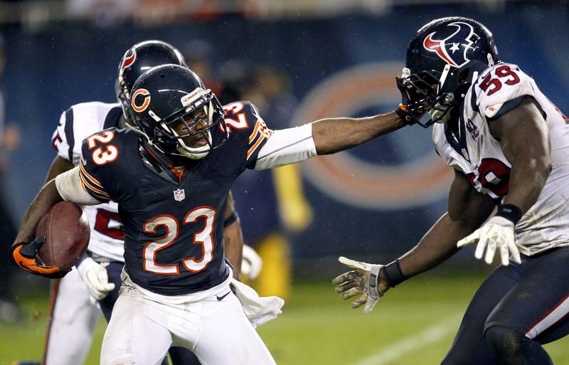 Chicago Bears' Devin Hester stiff-arms Houston Texans' Whitney Mercilus during a game, Sunday, Nov. 11, 2012, in Chicago. Devin Hester is a finalist for the Pro Football Hall of Fame's class of 2022.