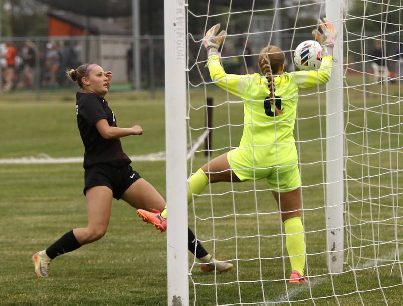 Prairie Ridge's Maelyn Growney keeps her eyes on the ball as Crystal Lake South's Madelyn Smith tries keep the ball out of the goal during a Class 2A Crystal Lake Central Regional girls soccer semifinal match on Tuesday, May 19, 2026, at Crystal Lake Central High School. Growney was able to kick the rebound into the goal.