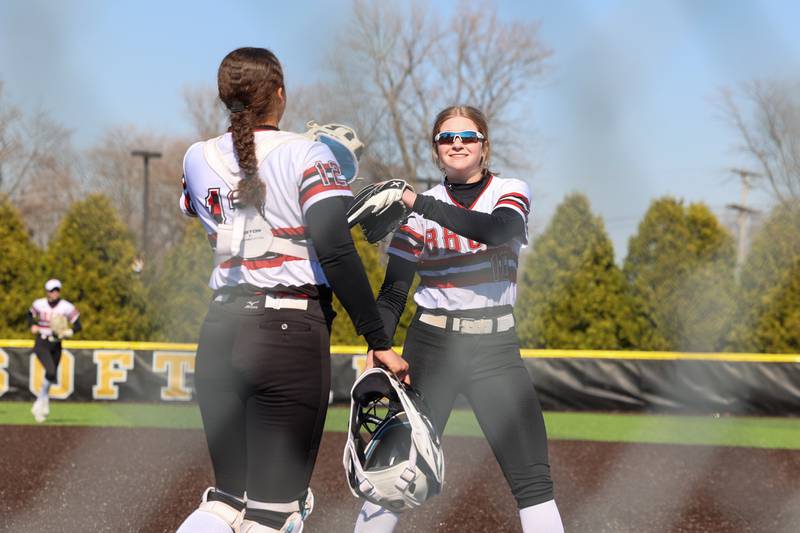Bradley-Bourbonnais pitcher Abbit Hofbauer, right, is congratulated on a strikeout by catcher Alayna Sykes during their game against Herscher on Monday, March 23, 2026.