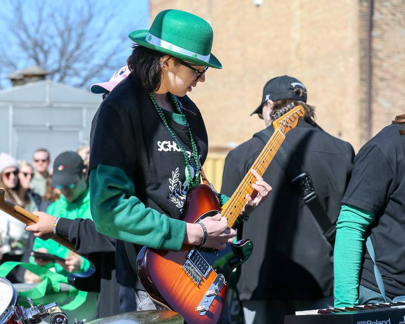 Students with the Lemont School of Rock perform on a float in the Lemont St. Pat's Day Parade on Saturday, March 8, 2025  in Lemont.