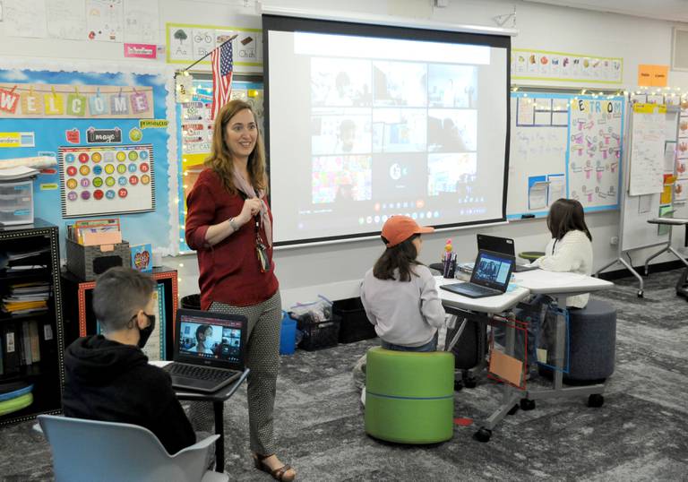 Victoria Garcia Blanco talks with her students while the class meets with students from Spain Wednesday, May 18, 2022, during a fifth-grade dual language class at Coventry Elementary School in Crystal Lake. Garcia Blanco, a native of Spain, organized the exchange to connect Coventry dual language students with students from Colegio Sagrado Corazón de Jesús Vedruna, the school in Spain where she previously taught.