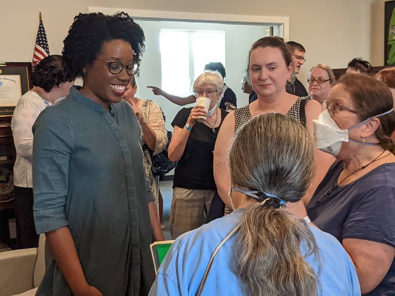 U.S. Rep. Lauren Underwood, D-Naperville, talks to constituents June 3 during an open house at her new office in Sandwich.