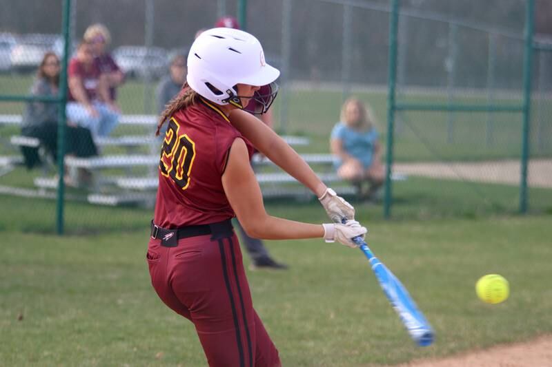 Richmond-Burton’s Mia Spohr connects for a home run in varsity softball at Marengo Tuesday.