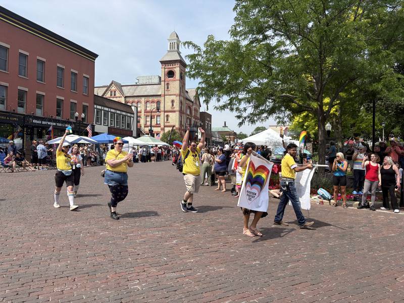 Woodstock Pride representatives walk in the Woodstock Pride parade June 15, 2025.