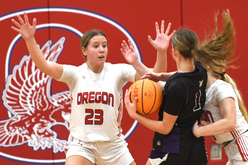 Oregon's Aniyah Sarver (23) and Airael Schutz (20) defend a Rockford Lutheran player on Saturday, Jan. 24, 2026 at the Blackhawk Center in Oregon.