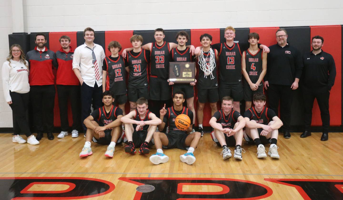 Members of the Indian Creek boys basketball team pose with the Class 1A Sectional plaque after defeating Marquette on Friday, March 6, 2026 at Amboy High School.
