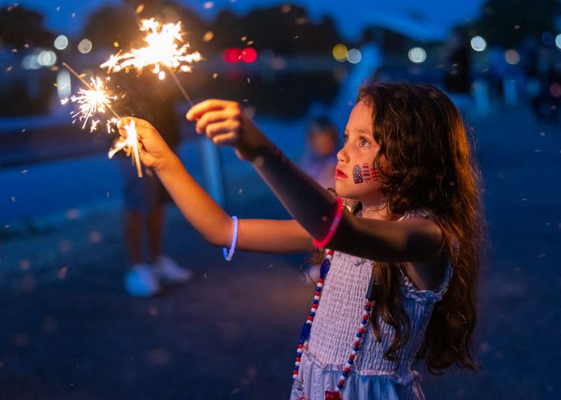 Arielle Ortiz dances with sparklers as she waits for the start of the fireworks on June 28, 2025 at Lake Mendota.