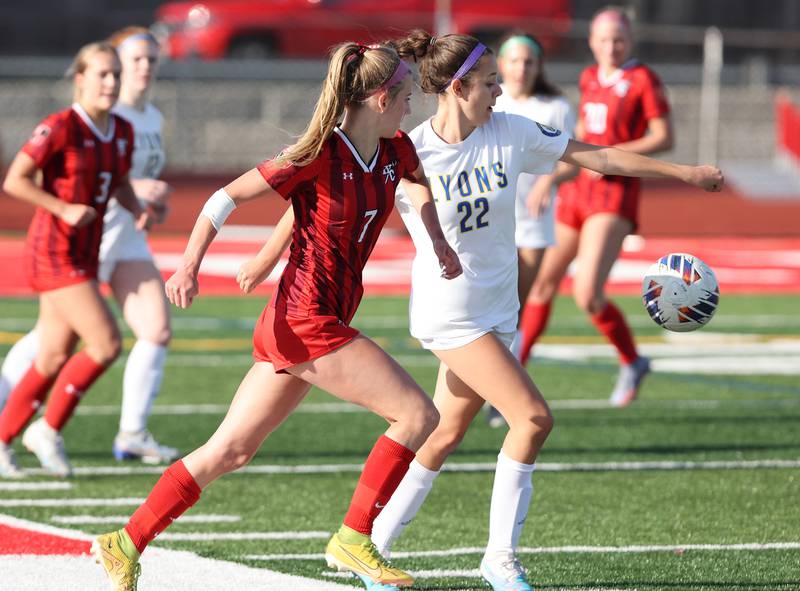 Hinsdale Central's Avery Edgewater (7) goes for the ball against Lyons Township's Peyton Israel (22) during the girls varsity soccer match between Lyons Township and Hinsdale Central high schools in Hinsdale on Tuesday, April 18, 2023.