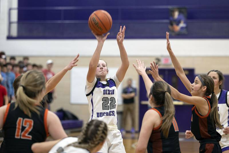 Dixon’s Katie Drew puts in a three point shot late in the game against Byron Tuesday, Jan. 24, 2023.