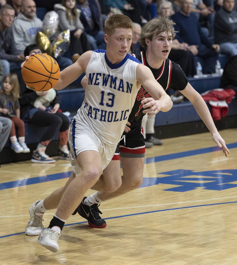 Newman’s George Jungerman drives to the hoop against Hall Friday, Jan. 17, 2025 at Newman High School.