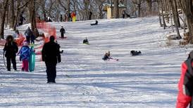 Sledders enjoy Johnson’s Mound hill following first winter snowstorm