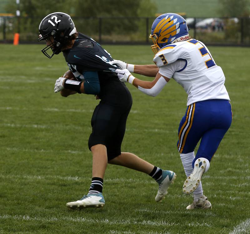 Woodstock North's Landan Creighton tackled by Johnsburg's Maddux Malachuk during a Kishwaukee River Conference football game Saturday, Aug. 26, 2023, at Woodstock North High School.