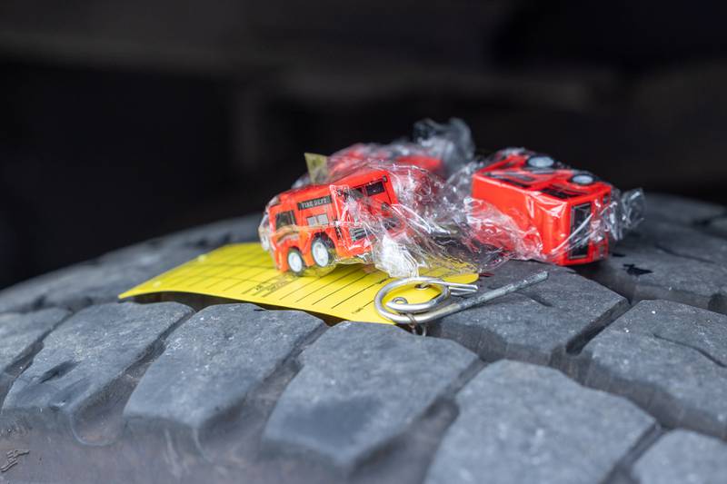 Toy fire trucks are given out at the Touch a Truck event on Sunday, July 27, 2025, at Riverfront Park in Ottawa.