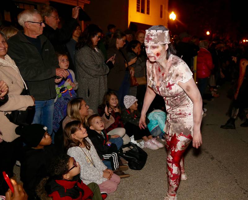 Kat Griseta portrays a zombie from Vargo’s Dance mingles with the crowd at the Sixth Annual Thriller on 38 on Friday, Oct. 20, 2023 in Geneva.