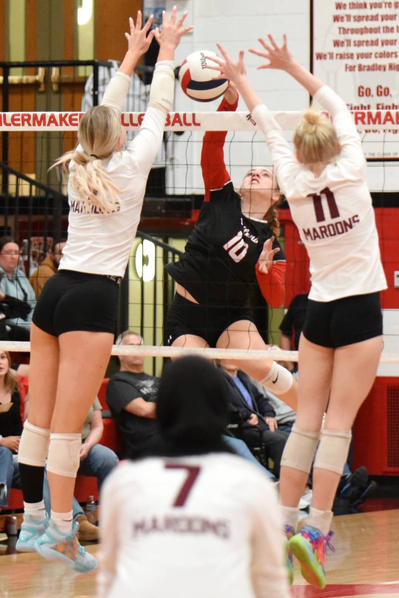 Bradley-Bourbonnais' Harper Tollefson (10) looks to place a hit between the Champaign Central defense during a game at Bradley-Bourbonnais Thursday, Oct. 23, 2025.