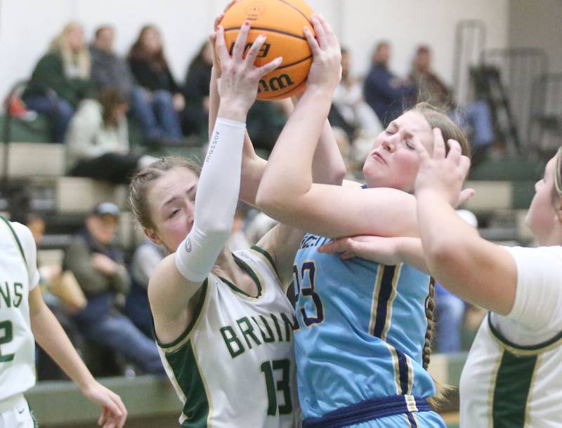 St. Bede's Ashlyn Ehm and Marquette's Lucy McGrath force a jump ball on Monday, Dec. 2, 2024 at St. Bede Academy.
