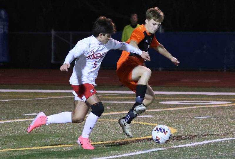 Hinsdale Central's Michael DiTomasso and Hersey's Nik Van De Mark try to gain possession Friday, Nov. 8, 2024, during their Class 3A state semifinal game at Hoffman Estates High School.