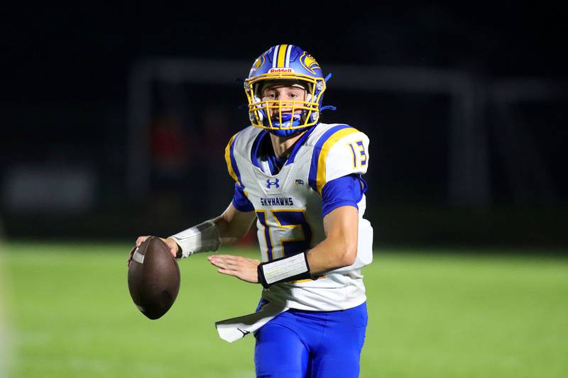 Johnsburg’s Carter Block scrambles with the ball in varsity football at Rod Poppe Field on the campus of Marengo High School in Marengo on Friday, Oct. 3, 2025.