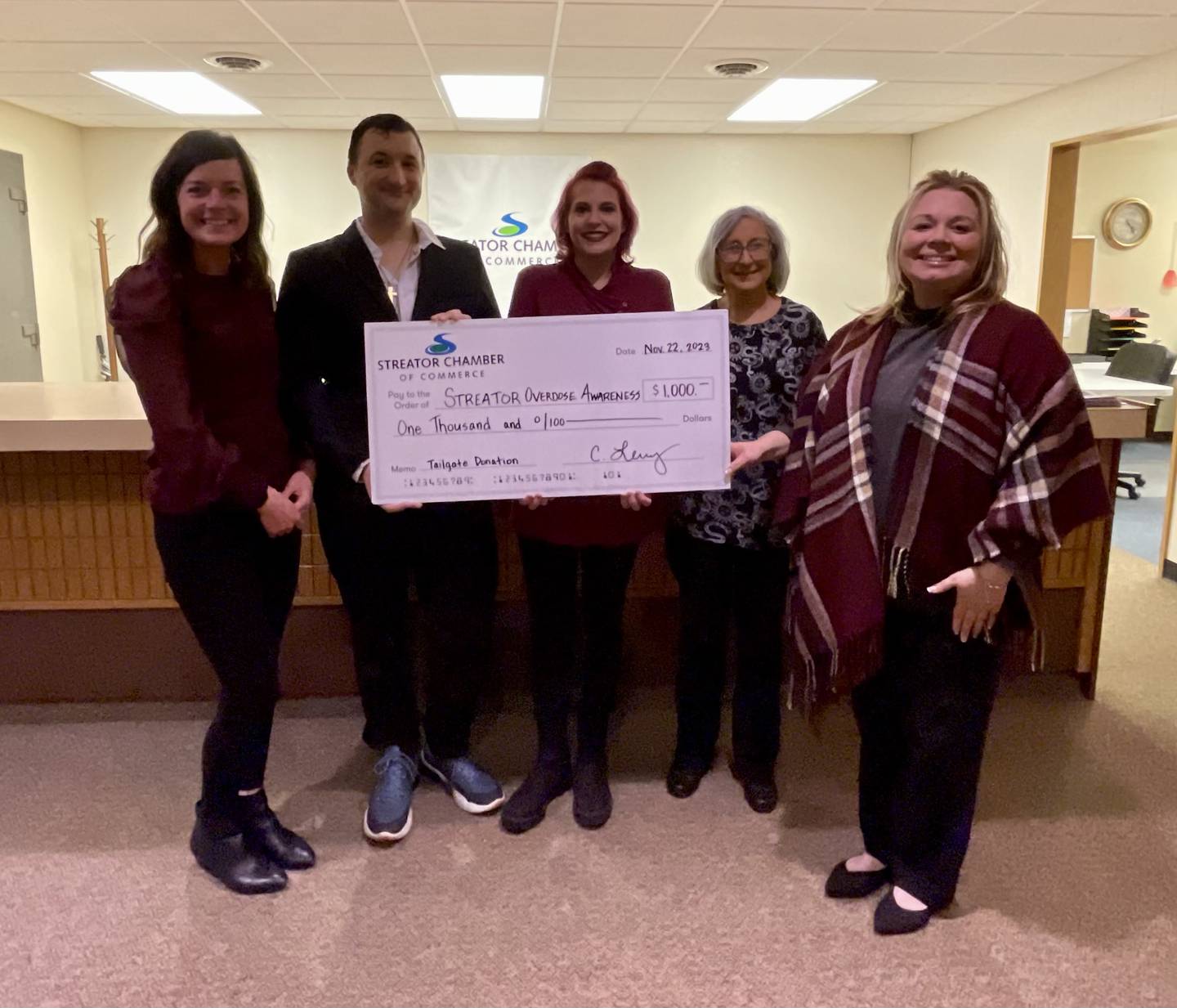 The Streator Chamber of Commerce presented the Streator Overdose Awareness Memorial Walk with a $1,000 check with proceeds from its Nov. 4 tailgate fundraiser.