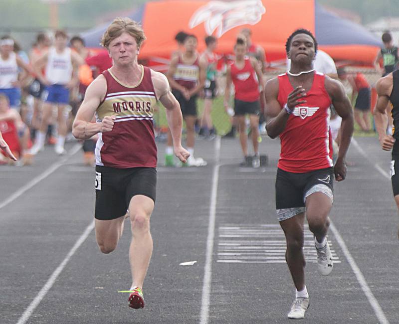 Streator's Aneefy Ford (right) runs neck-and-neck with Morris' Myles Johnston in the 100-meter dash in the 2022 Plano Sectional.