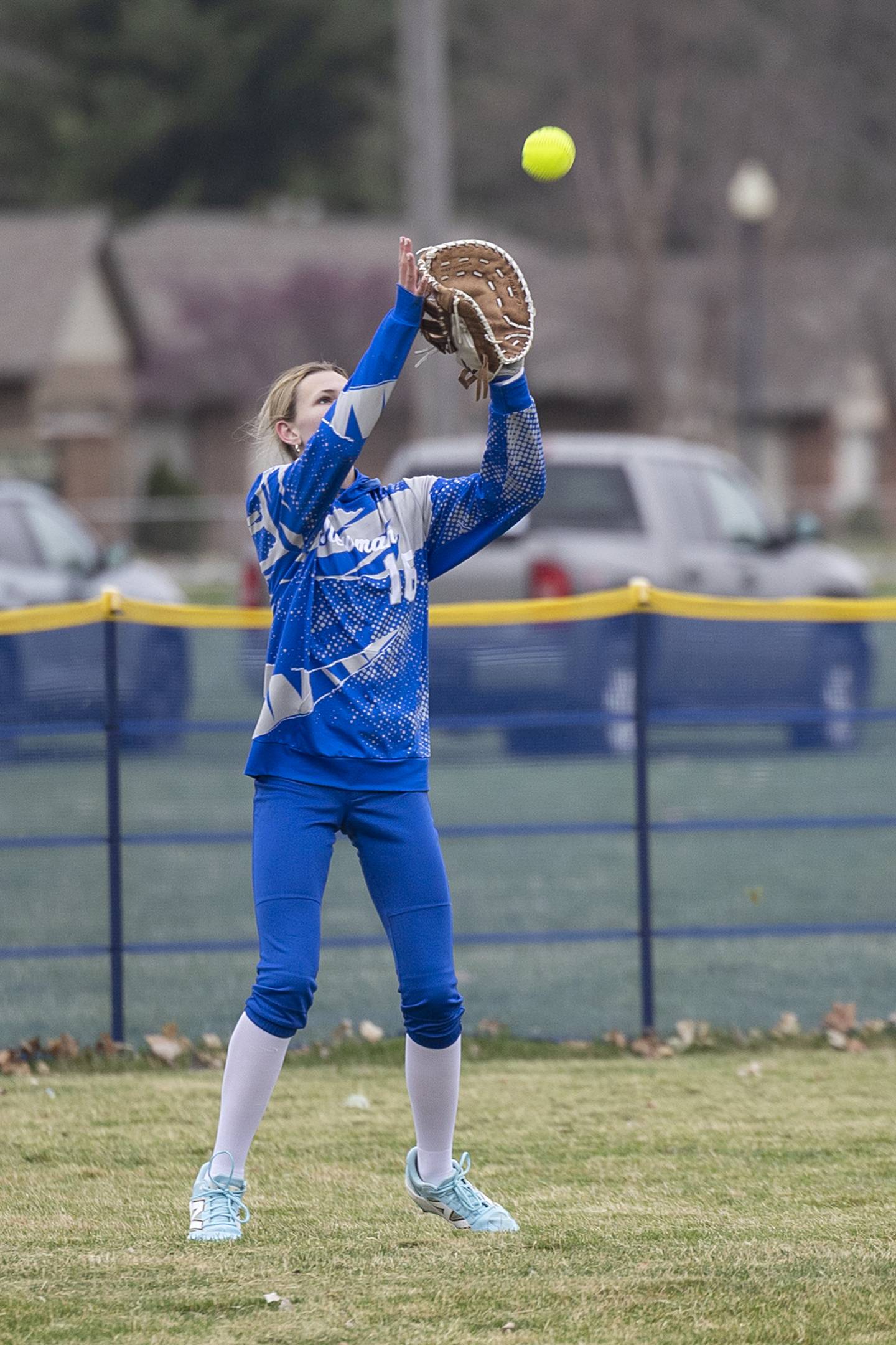 Newman’s Grace Woodward hauls in a fly ball against Lena-Winslow Wednesday, April 1, 2026.
