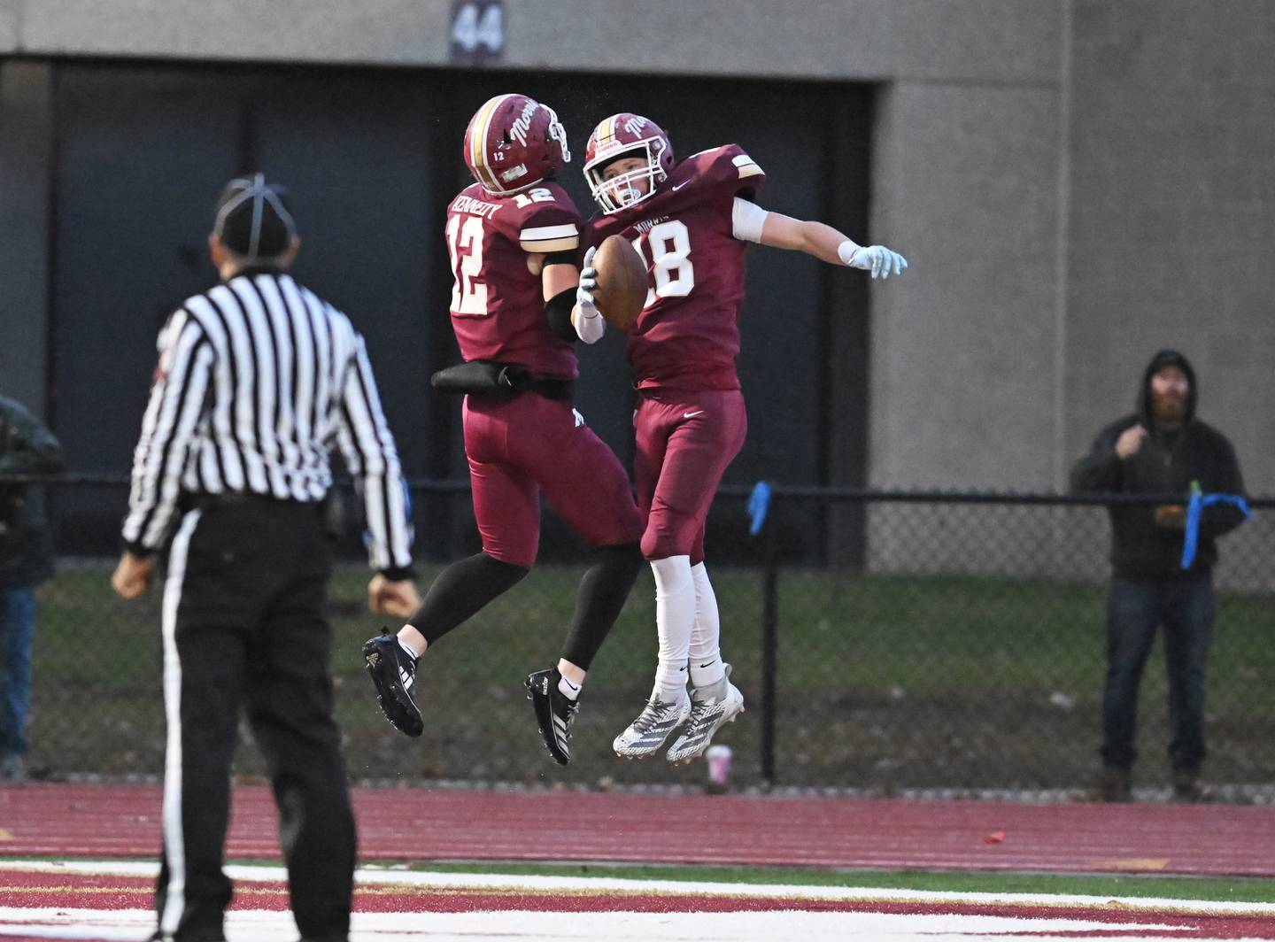 Morris Logan Conroy (18) celebrates with Austin Enerson (12) after scoring a touchdown during the class 4A second round playoff game against Metamora on Saturday, NOV. 08, 2025, at Morris.