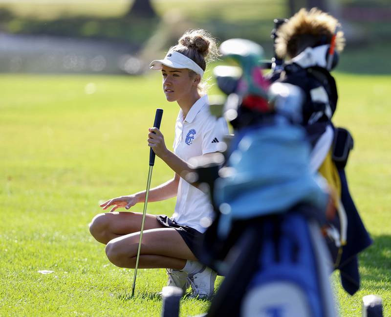 Bridget Brennan of Wheaton St. Francis, looks for her line during the IHSA Class 2A West Chicago girls golf regional at St. Andrews Tuesday, Oct. 1, 2024 in West Chicago.