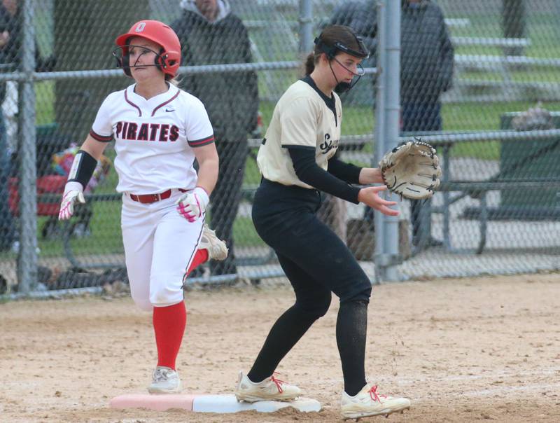 Ottawa's Reese Purcell reaches first base as Sycamore first baseman Riley Schuller waits for the throw on Tuesday, May 5, 2026 at Peck Park in Ottawa.