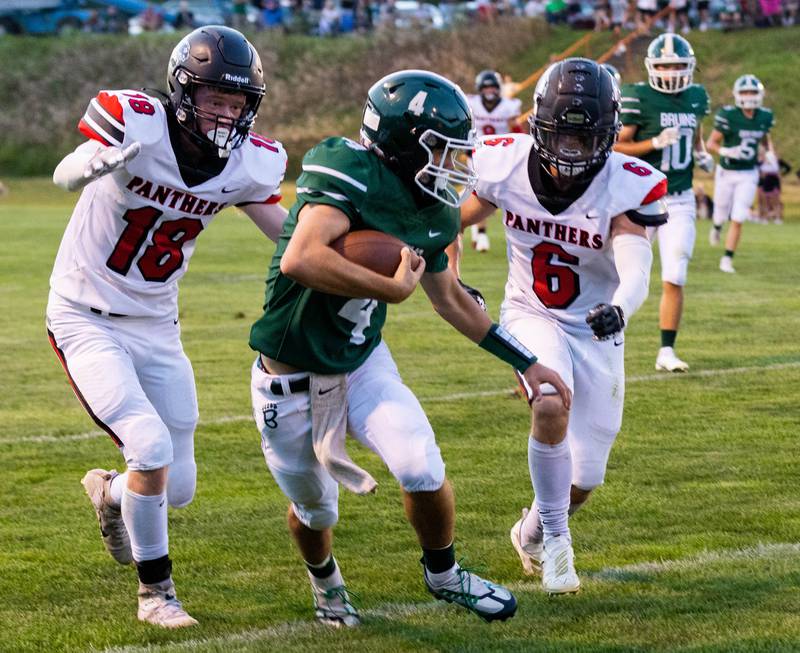 St. Bede quarterback John Brady (4) runs the ball during the first quarter Friday, Sept. 2, 2022 in Peru.