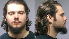 Oswego man charged with firing gun in downtown parking garage