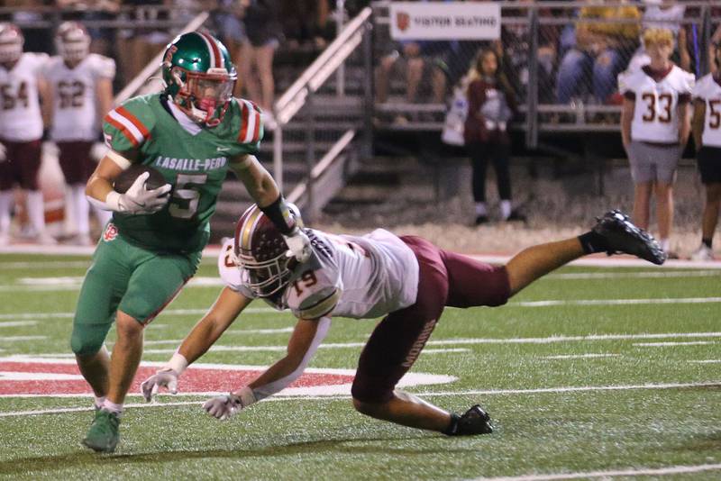 L-P's Brevyn Vogel runs the ball as Morris's Logan Sparrow misses the tackle on Friday, Sept. 20, 2024 at Howard Fellows Stadium.