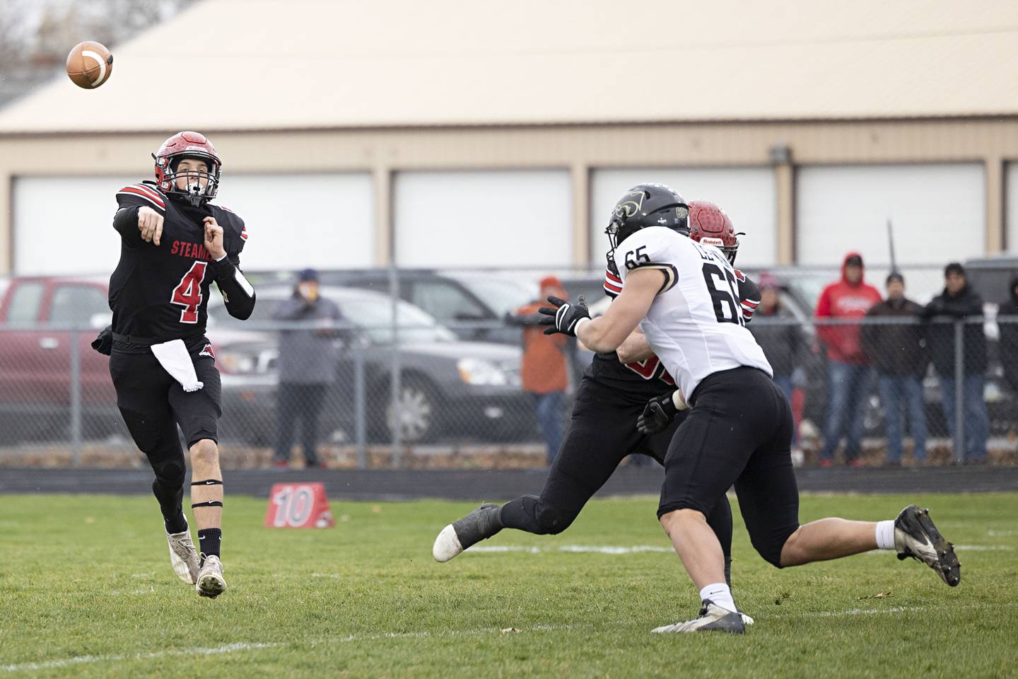Fulton’s Brayden Dystra throws a pass downfield Saturday, Nov. 12, 2022 in a quarterfinal game against Le/Win.