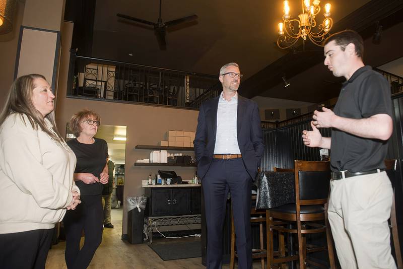 Saleena Surratt (left), Christine Siperly and Carson Burns speaks about the Secure Choice program to state of Illinois treasurer Michael Frerichs Tuesday, April 12, 2022 at Smoked on Third in Sterling. Frerichs stopped by to ask how the restaurant workers felt about the retirement program. Siperly has spent most of her working life in the restaurant business and "never really had the opportunity for a 401K. This program will really help now that I'm nearing retirement age."