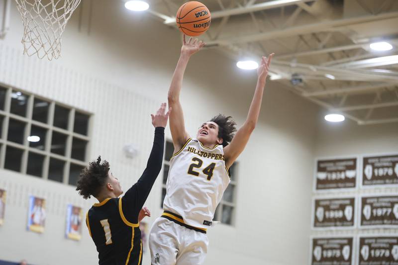 Joliet Catholic’s Elias Passehl floats a shot against Elmwood Park in the Class 3A Joliet Catholic Regional semifinal game on Wednesday, Feb. 25, 2026 in Joliet.
