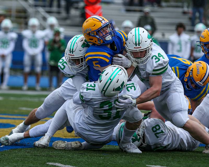 Lyon's Danny Caroll (5) is gang tackled by the York defense during football game between York at Lyons.   Oct 14, 2023.