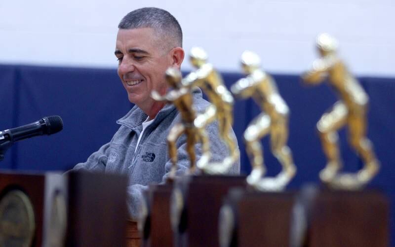 Head Coach Brad Seaburg addresses the audience during a celebration of the IHSA Class 6A Cary-Grove football team at the high school Sunday.