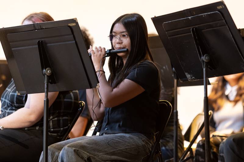 Marjorie Santos plays the piccolo with the Joliet Central Band during the Veterans Day Assembly at Joliet Central High School on Nov. 7, 2025.