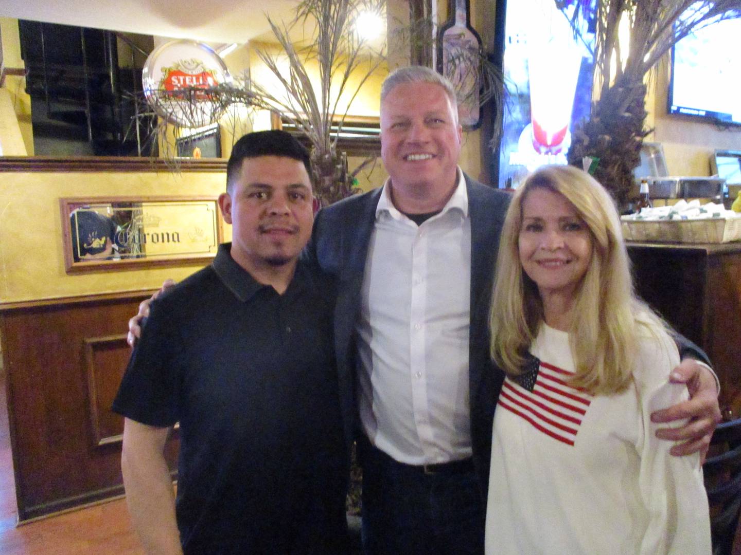 The three top vote-getters in the Joliet City Council election on Tuesday night pose for a photo at a watch party that they attended with supporters. April 1, 2025