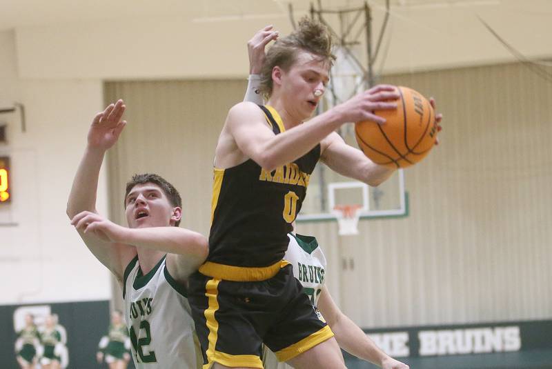 Ashton-Franklin Center's Aaron Lester grabs a rebound over St. Bede's Carson Riva during the Class 1A Regional quarterfinal game on Monday, Feb. 24, 2025 at St. Bede Academy.